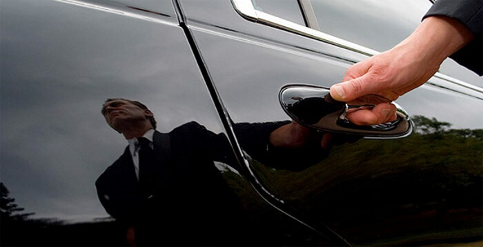 limo driver opening limo door